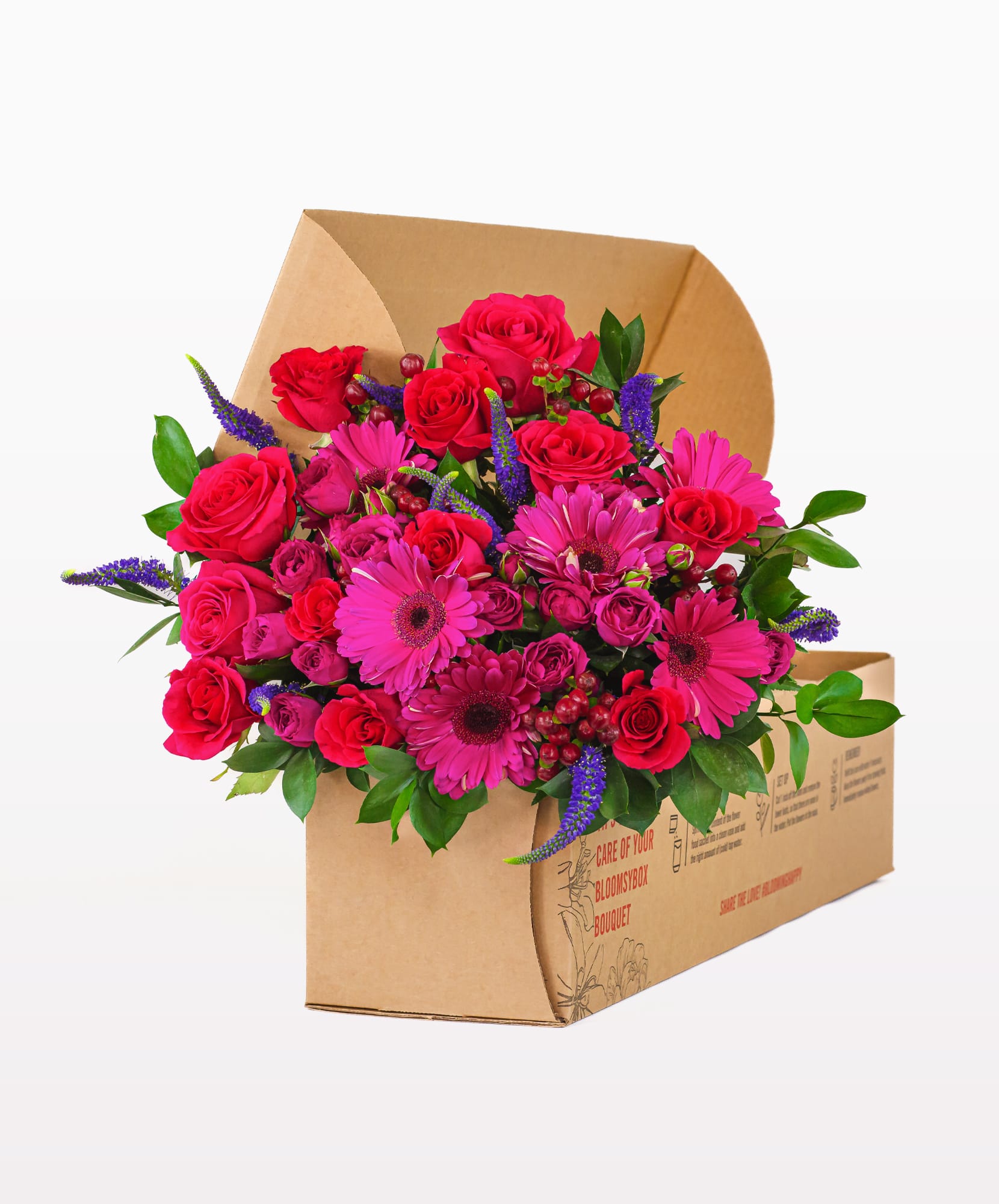 Bright and vibrant floral bouquet featuring red roses and pink gerberas, elegantly packaged.